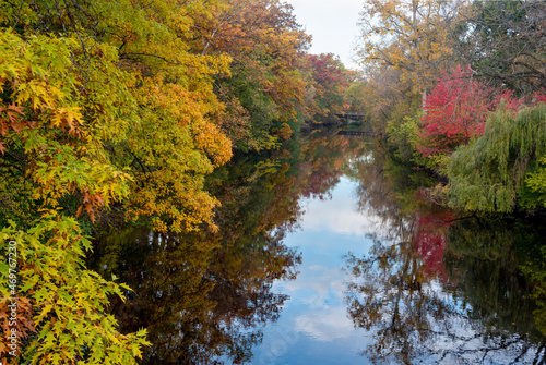 Red Cedar river winding through Michigan State University campus during the Fall photo