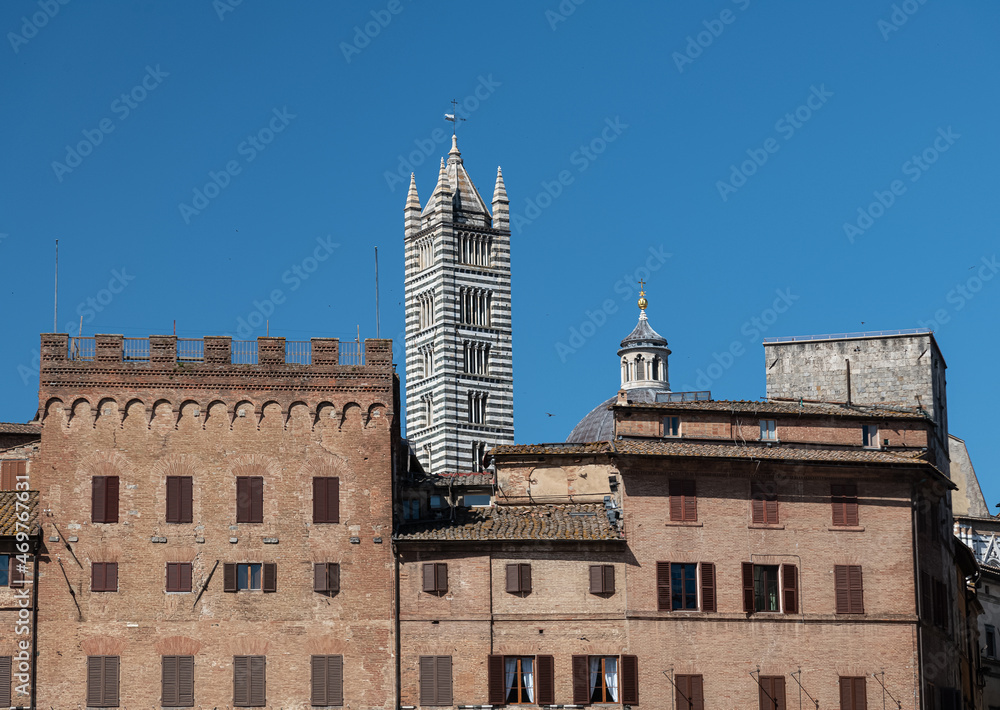 Piazza del Campo with Tower of Duomo di Siena Behind Houses, Siena, Italy