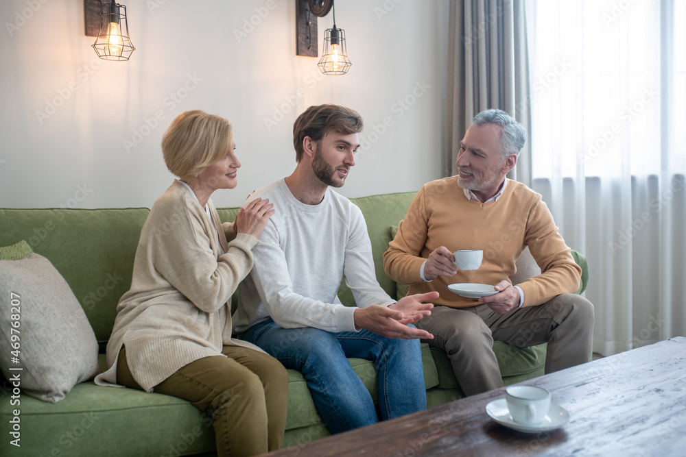 Family sitting together and talking Family sitting together and talking