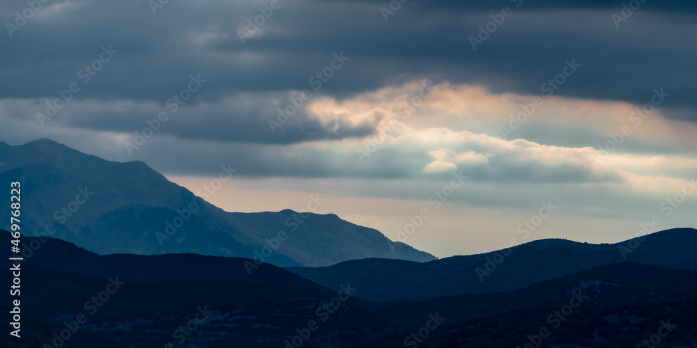 Sunset clouds over the mountainside
