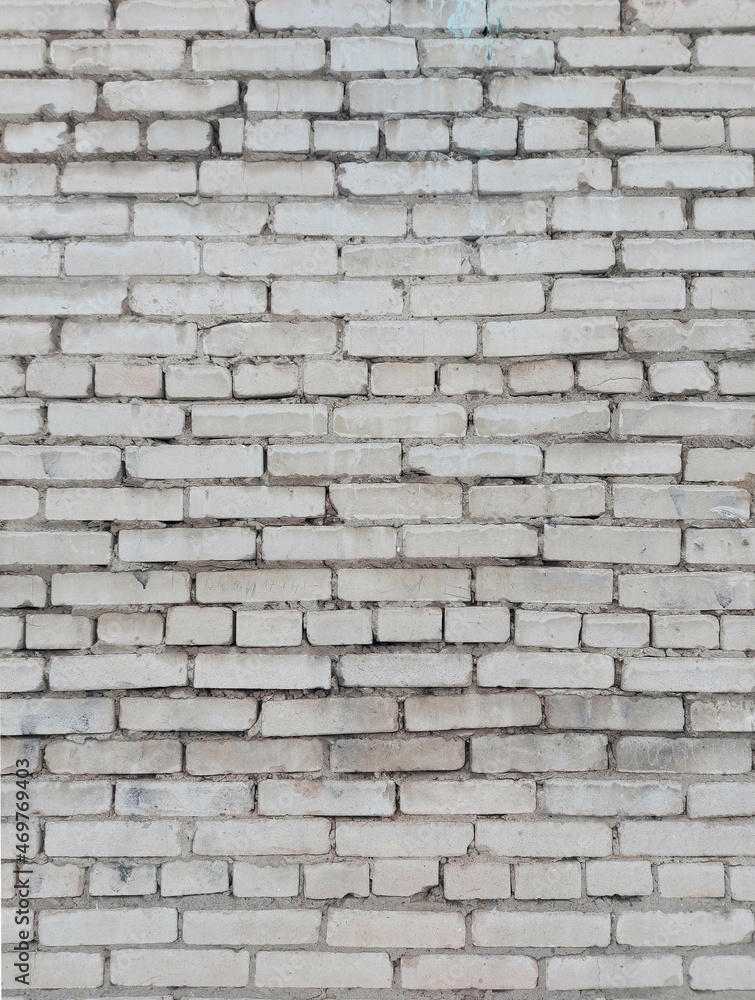 Old white brick wall. Vertical arrangement. Old white brick wall. Vertical arrangement.