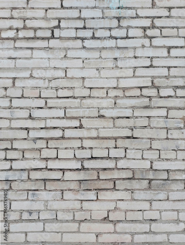 Old white brick wall. Vertical arrangement.