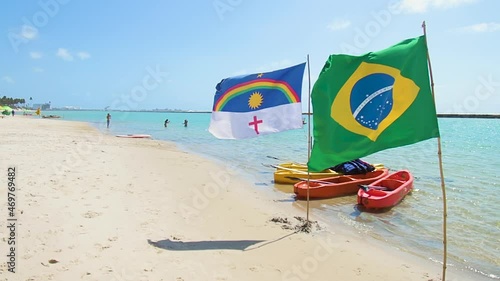Brazilian and Pernambuco state flags at Muro Alto beach, at Ipojuca PE, Brazil. Northeastern Brazilian beach.