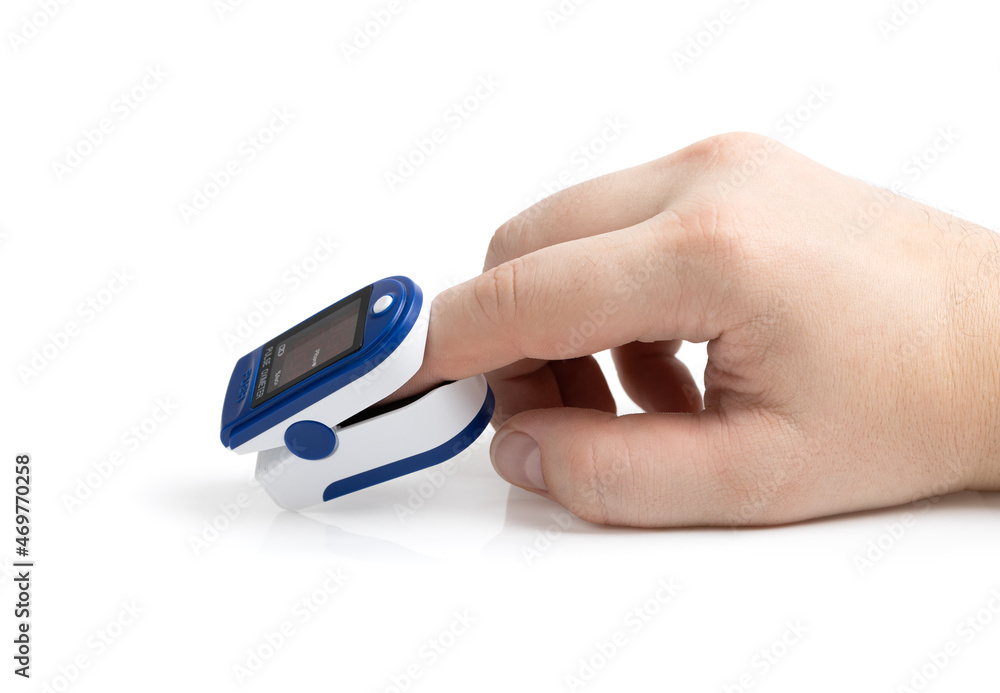 Pulse oximeter on white background.Medical diagnostic device for non-invasive measurement of capillary blood oxygen saturation level. Medical device on the finger. Pulse oximeter on white background.Medical diagnostic device for non-invasive measurement of capillary blood oxygen saturation level. Medical device on the finger.