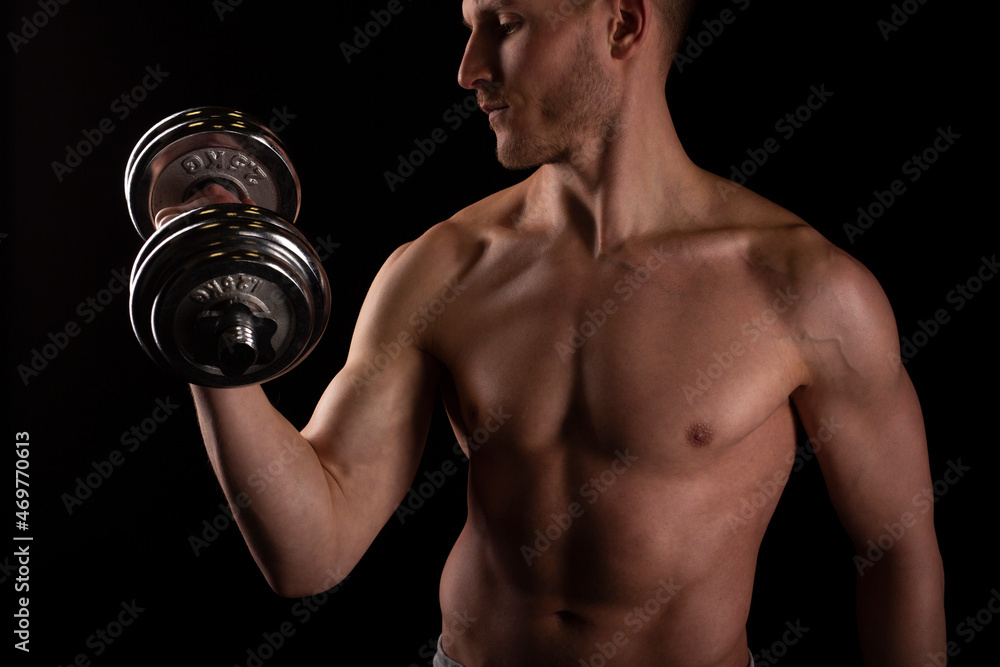 Man Pumping Biceps with Dumbbell Topless. Sprotsman Doing Traning on Biceps Muscles. Gym, Lifting Sport Concept. Close Up