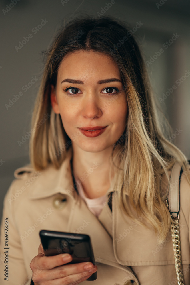 Businesswoman using smartphone while outside Businesswoman using smartphone while outside