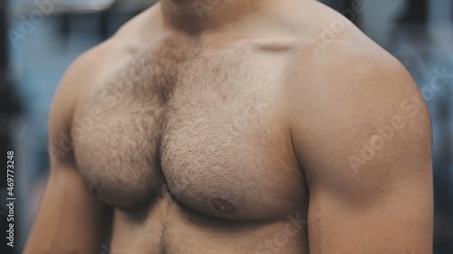 Картината върху платно A man moves his strong and muscular chest