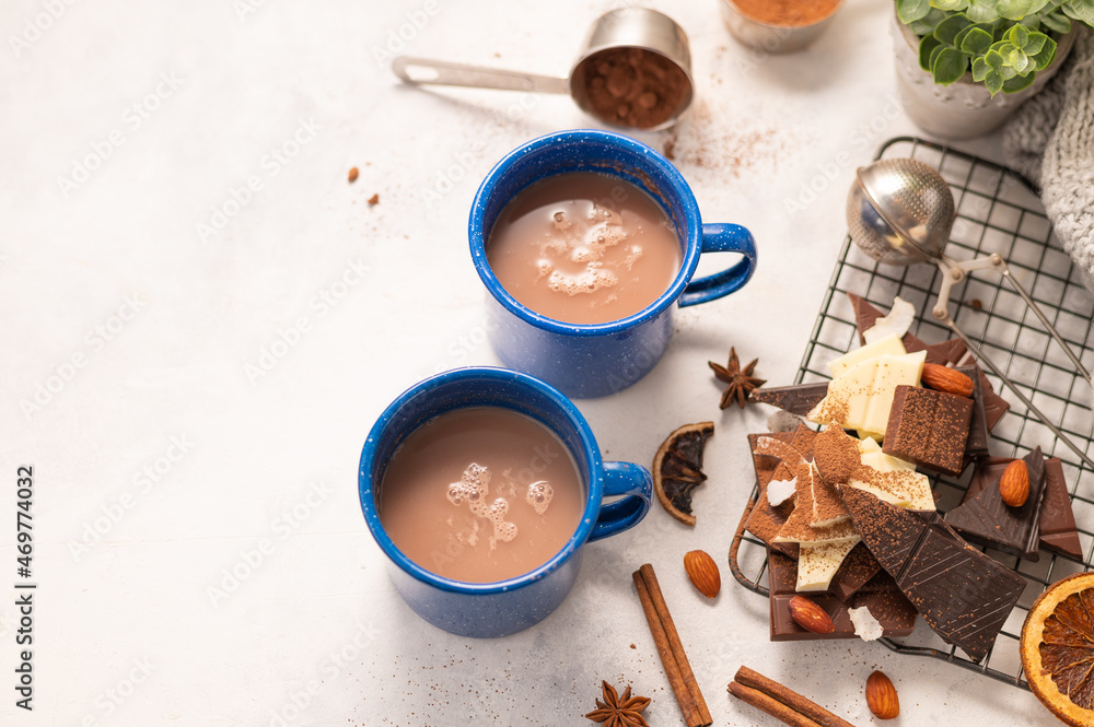 On a white background, two blue cups of aromatic coffee latte, chocolate, decor. Restaurant, hotel, cafe, pastry shop, culinary blog, instagram, advertising, banner. On a white background, two blue cups of aromatic coffee latte, chocolate, decor. Restaurant, hotel, cafe, pastry shop, culinary blog, instagram, advertising, banner.