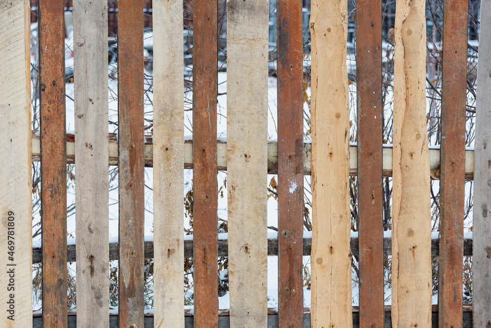 New fence made of old boards. New fence made of old boards.