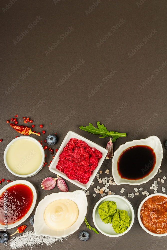 Set of different sauces - ketchup, mayonnaise, barbecue, soy, chutney, wasabi, adjika, horseradish Set of different sauces - ketchup, mayonnaise, barbecue, soy, chutney, wasabi, adjika, horseradish