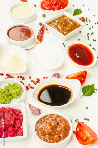 Set of different sauces - ketchup, mayonnaise, barbecue, soy, chutney, wasabi, adjika, horseradish