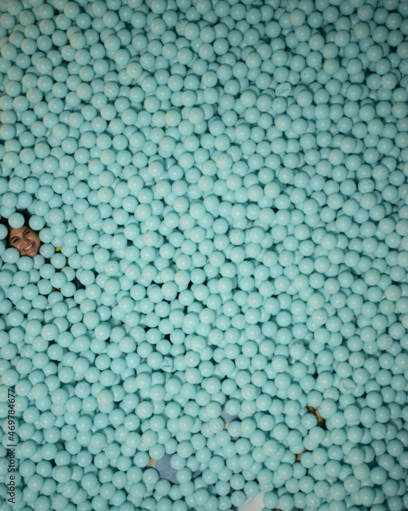 Girl in pool of blue balls Girl in pool of blue balls