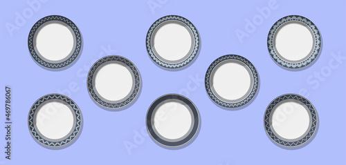 set of round flat empty plates gray plates with dark different patterns top view