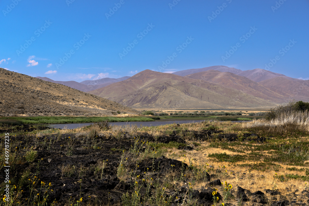 A lake surrounded by Volcanic Rock at Crater of the Moon