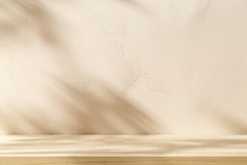 Wooden table mockup on stucco background with branch shadows on the wall. Mock up for branding products, presentation and health care.	
