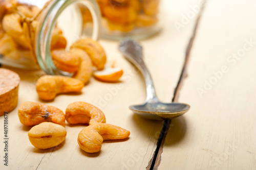 cashew nuts on a glass jar photo