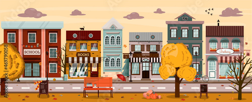 Vector autumn street with houses, cafes, bookstore, bakery, school, coffee shop. Flat illustration of the city in the European style. Cartoon autumn city with a park and pumpkins