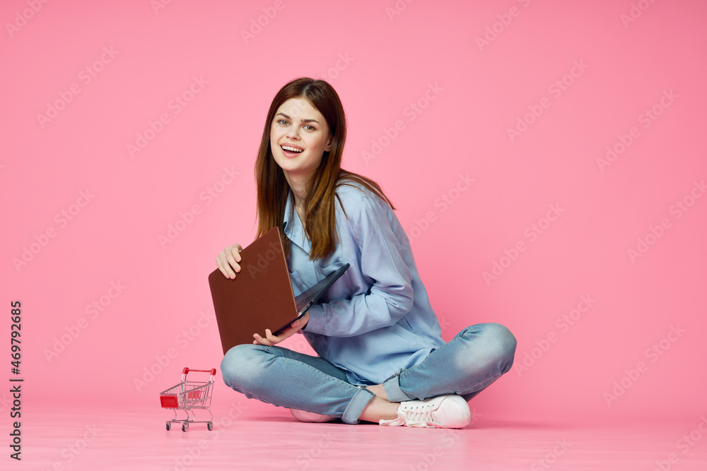 woman with laptop on pink background online shopping entertainment woman with laptop on pink background online shopping entertainment