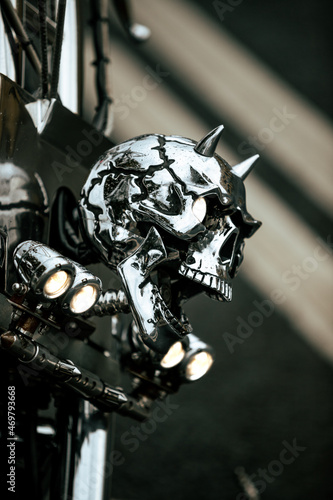 the front headlight of a motorcycle in the shape of a skull
