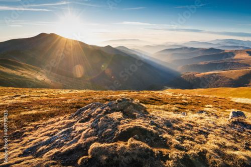 Wonderful sunset in the Carpathians. Mountain travel, freedom and active lifestyle concept. The beauty of the Carpathian Mountains. Bright photowall-paper.