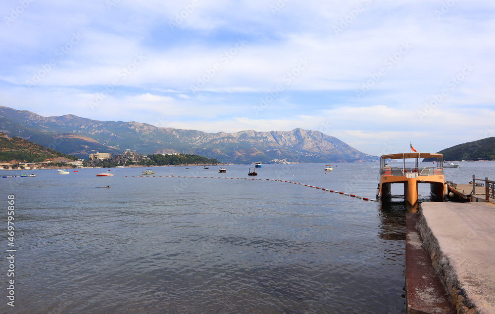 View of St. Nicholas Island and pier in Budva, Montenegro View of St. Nicholas Island and pier in Budva, Montenegro