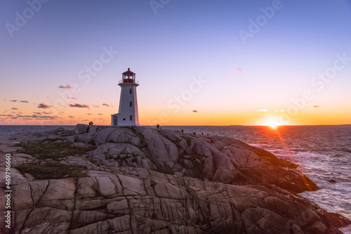 A dramatic sunset at Peggy s Cove Lighthouse Atlantic Coast Nova Scotia Canada. The most visited tourist location in the Atlantic Canada