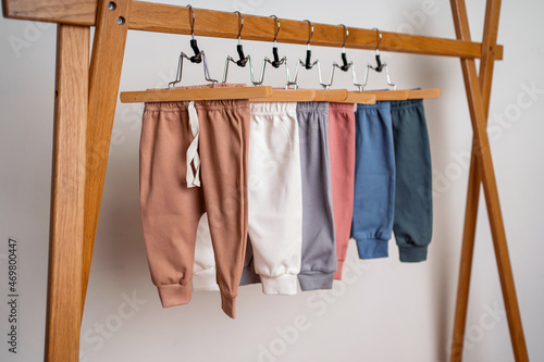 Comfortable pajamas and soft fabric for babies. For a child from zero to two years old, colored on a hanger. Children's store sale of fashionable clothes.