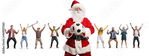 Santa claus holding a football and people cheering in the back © Ljupco Smokovski