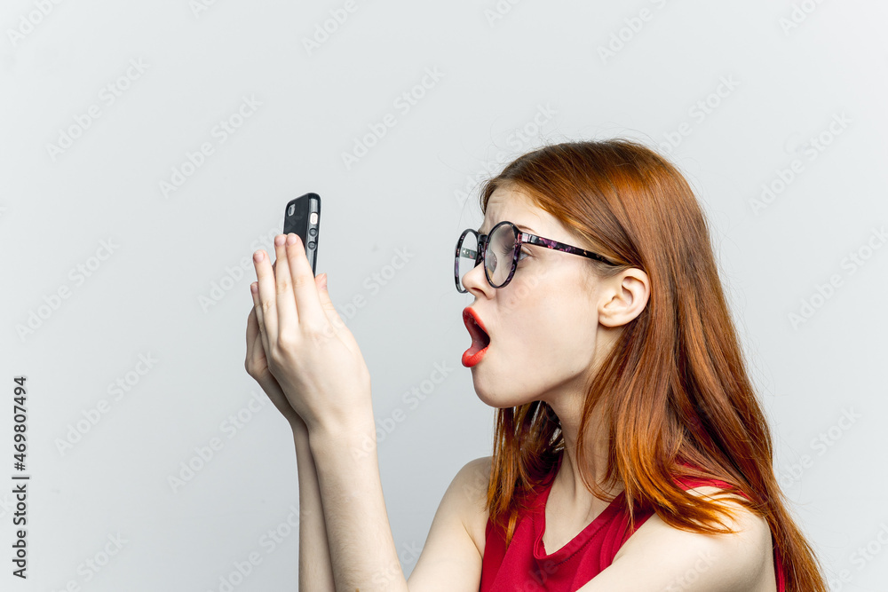 pretty woman in glasses with phone in hands communication technology