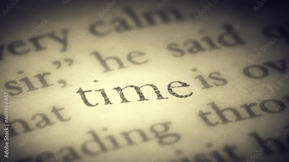 The word Time on the old page in the book is separated from the general text and zooms into the camera. Creative 3D 4k slow motion video animation. The word Time on the old page in the book is separated from the general text and zooms into the camera. Creative 3D 4k slow motion video animation.
