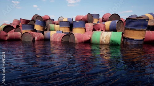 Hundreds of old disused oil barrels discarded into the environment, polluting the land and destroying the water with horrendous toxic waste. photo