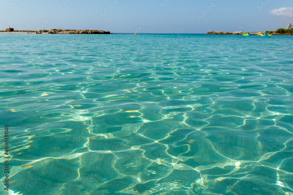 Crystal clear blue water of Mediterranean sea on Nissi beach in Ayia Napa, Cyprus