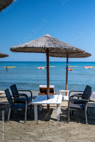 Beach unbrellas and chairs on sunny sandy beach Lady s mile in Akritori  Cyprus
