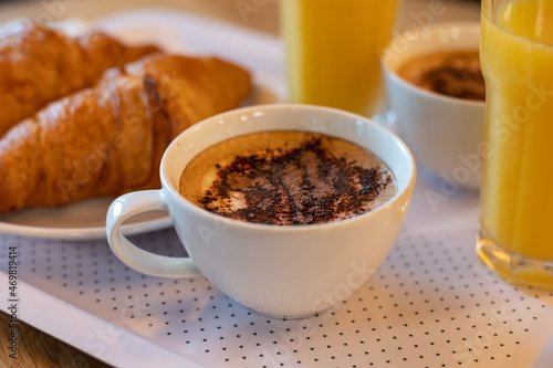 French breakfast with fresh baked croissants, coffee and orange juice