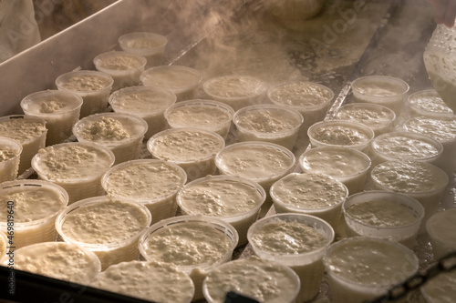 Process of making fresh white soft ricotta whey cheese on small cheese farm in Parma  Italy