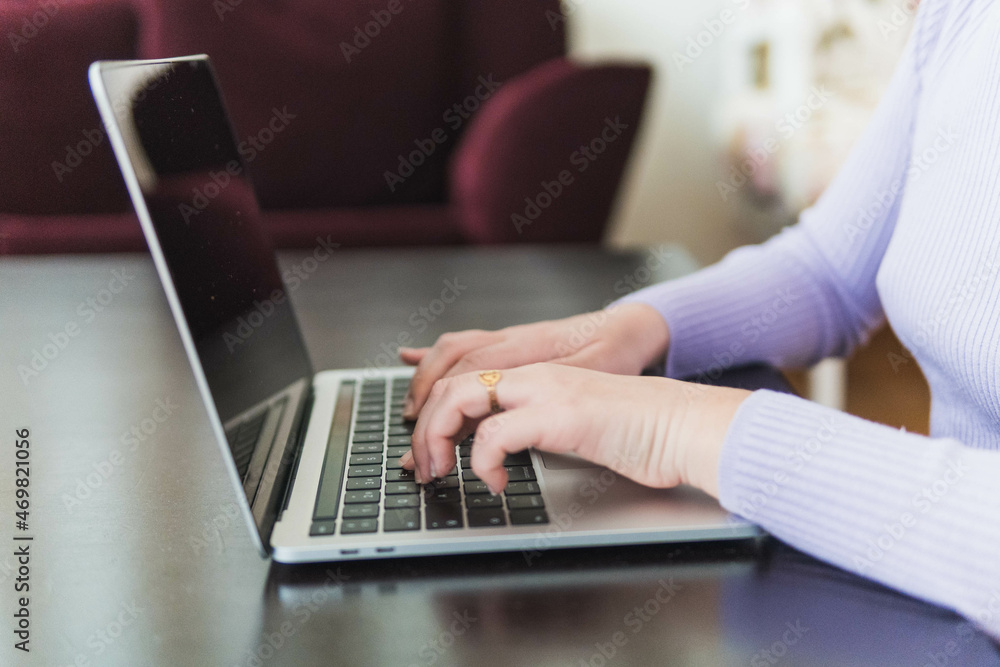 person hands typing on laptop on desk person hands typing on laptop on desk