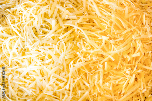 Grated cheese texture background, colonial cheese.