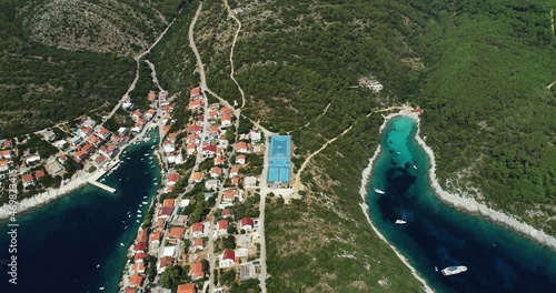 Aerial view of sporting place on hilltop between a paradise bay and Zavalatica town on Korcula Island, Dalmatia, Croatia. photo