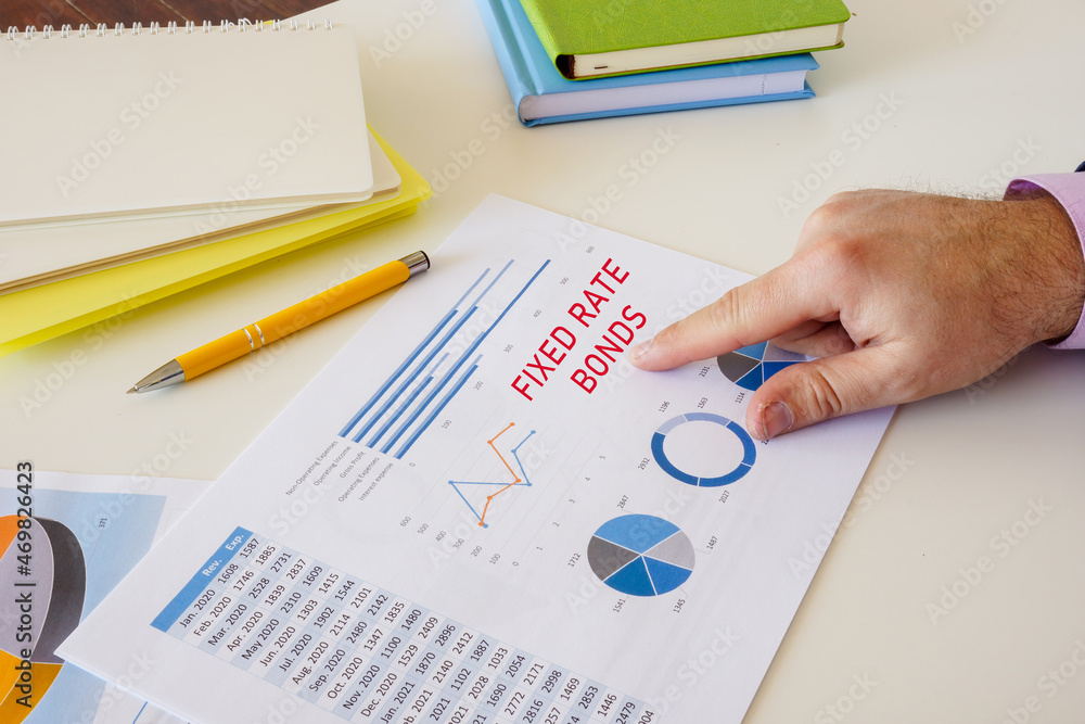 Financial concept about FIXED RATE BONDS with inscription on the sheet. Financial concept about FIXED RATE BONDS with inscription on the sheet.