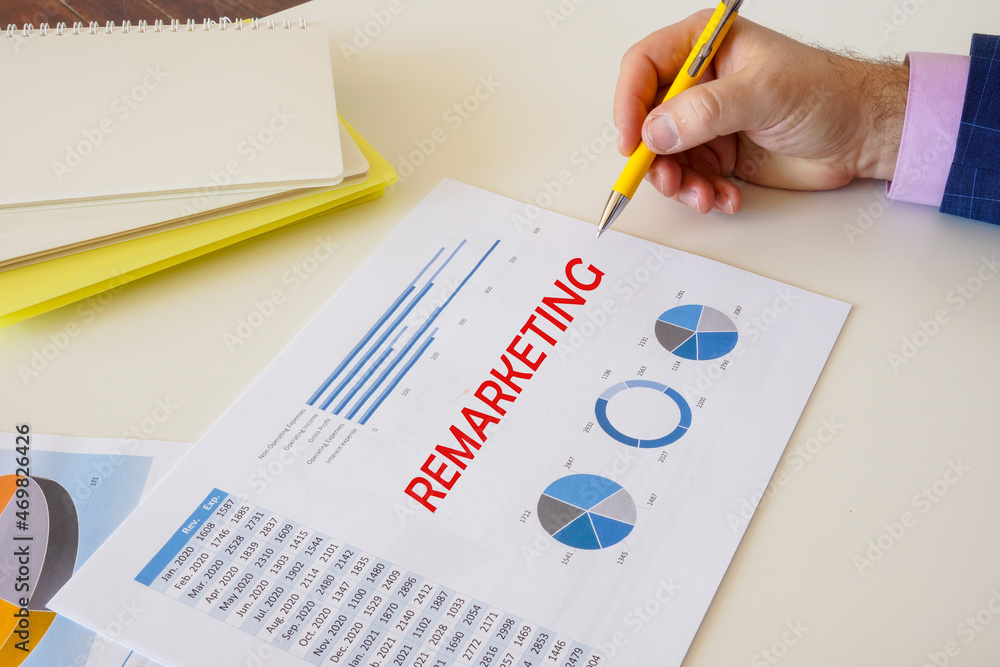 Financial concept about REMARKETING with sign on the page. Financial concept about REMARKETING with sign on the page.