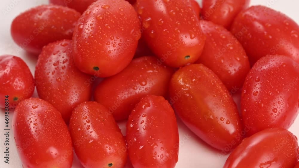 Close-up of swirling cherry tomatoes. Close-up of swirling cherry tomatoes.