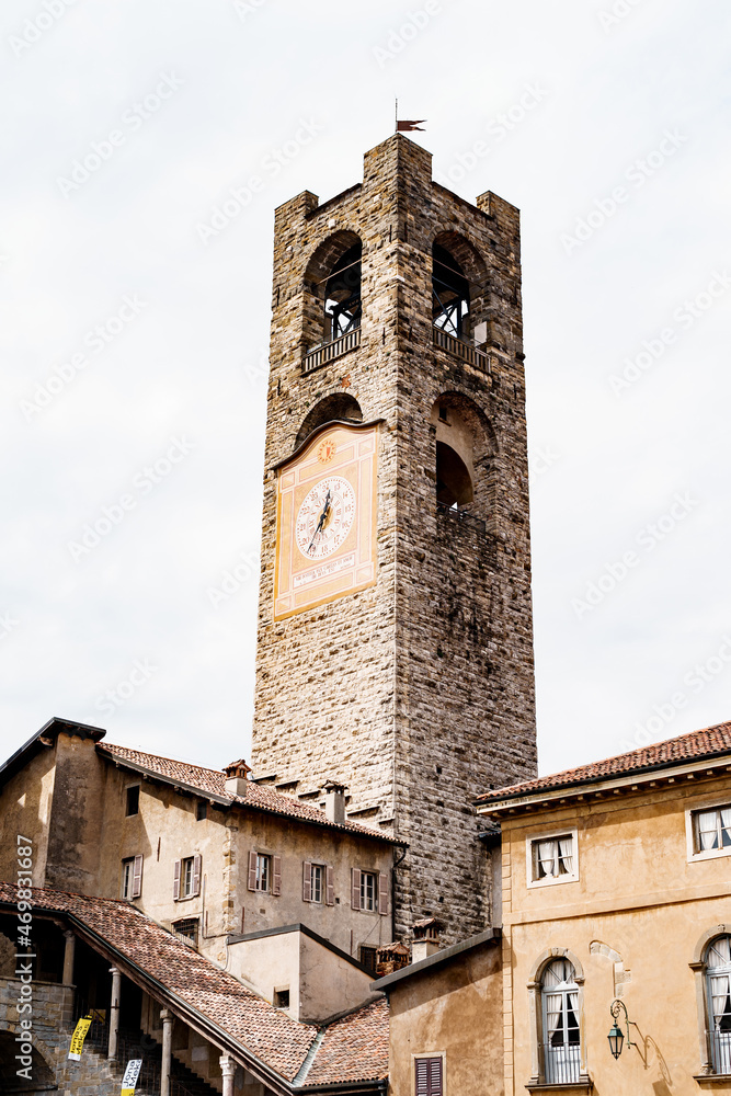 Gombito Tower with a clock on the facade in Citta Alta. Bergamo, Italy