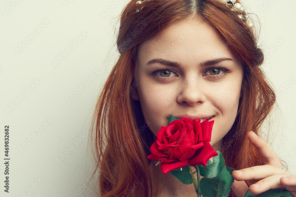 beautiful red-haired woman rose flower close-up charm beautiful red-haired woman rose flower close-up charm