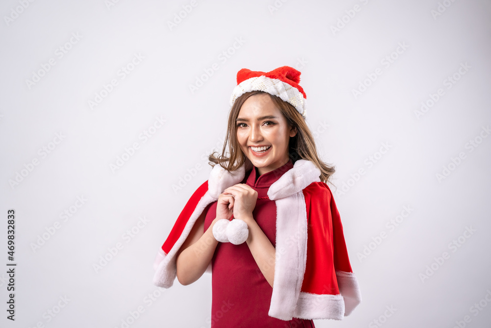 Portrait of a happy beautiful woman in red santa claus costume,Attractive young woman in red dress and hat,Christmas celebration. Portrait of a happy beautiful woman in red santa claus costume,Attractive young woman in red dress and hat,Christmas celebration.