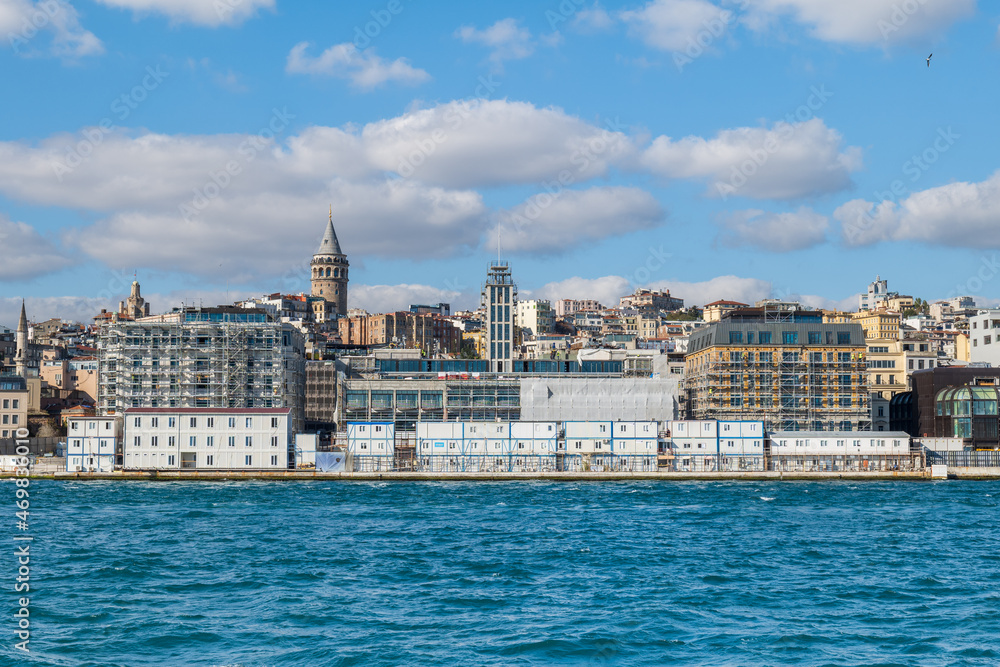 Istanbul cityscape with Galata tower in the background. City view of Karakoy and Galata district of Istanbul seen from Bosphorus, the strait of Istanbul.