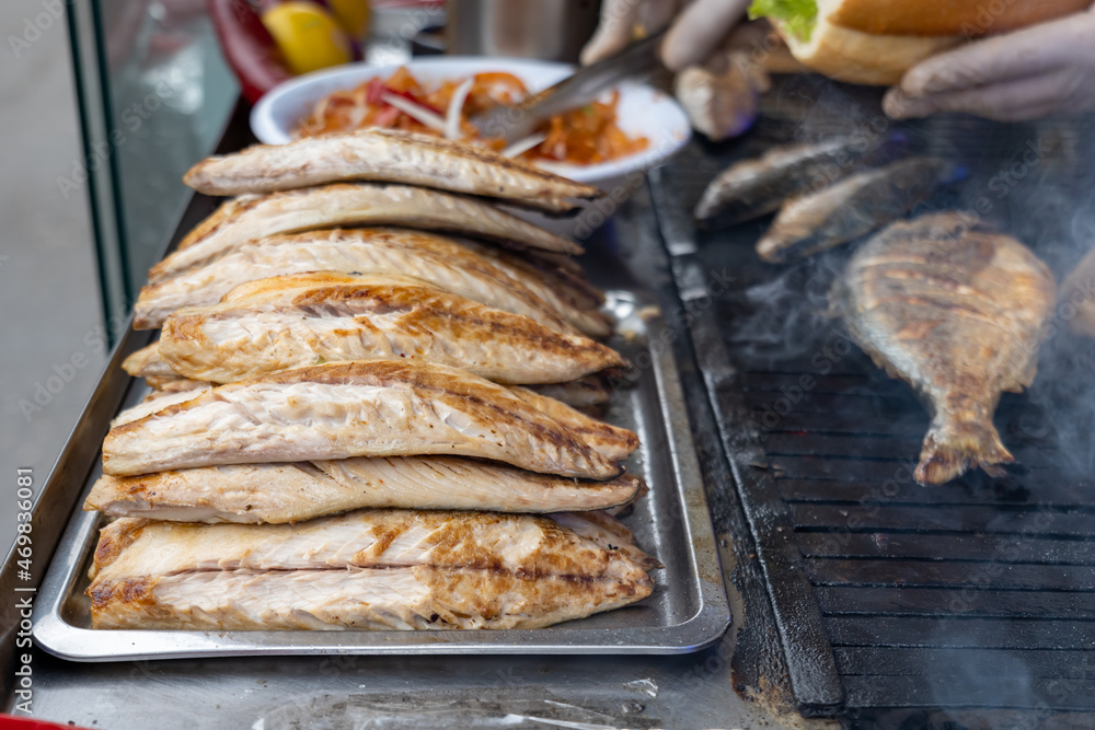 Grilled fish in Istanbul. Grilled mackerel for the popular street food in Turkey, Balik Ekmek, a Turkish fish sandwitch.