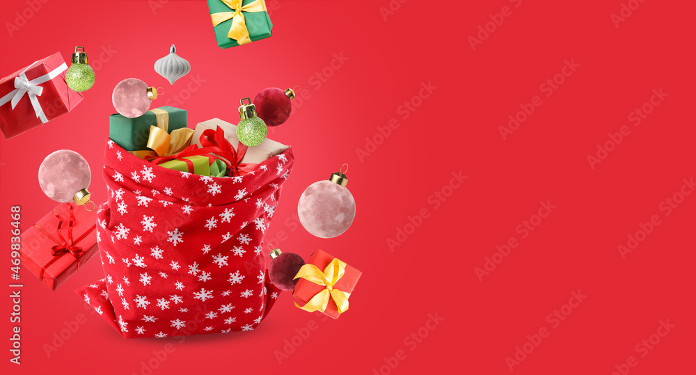 Santa Claus bag full of gifts on white background