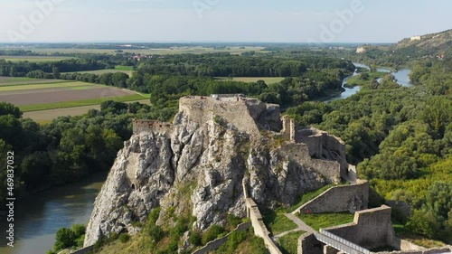 Cinematic drone footage of Hrad Devin castle, rotating aerial shot photo