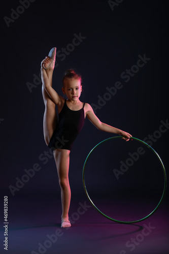 Little girl doing gymnastic...