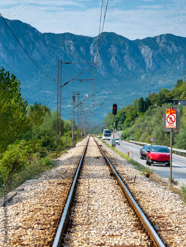 Railway tracks leading into a distant mountain landscape,Montenegro.